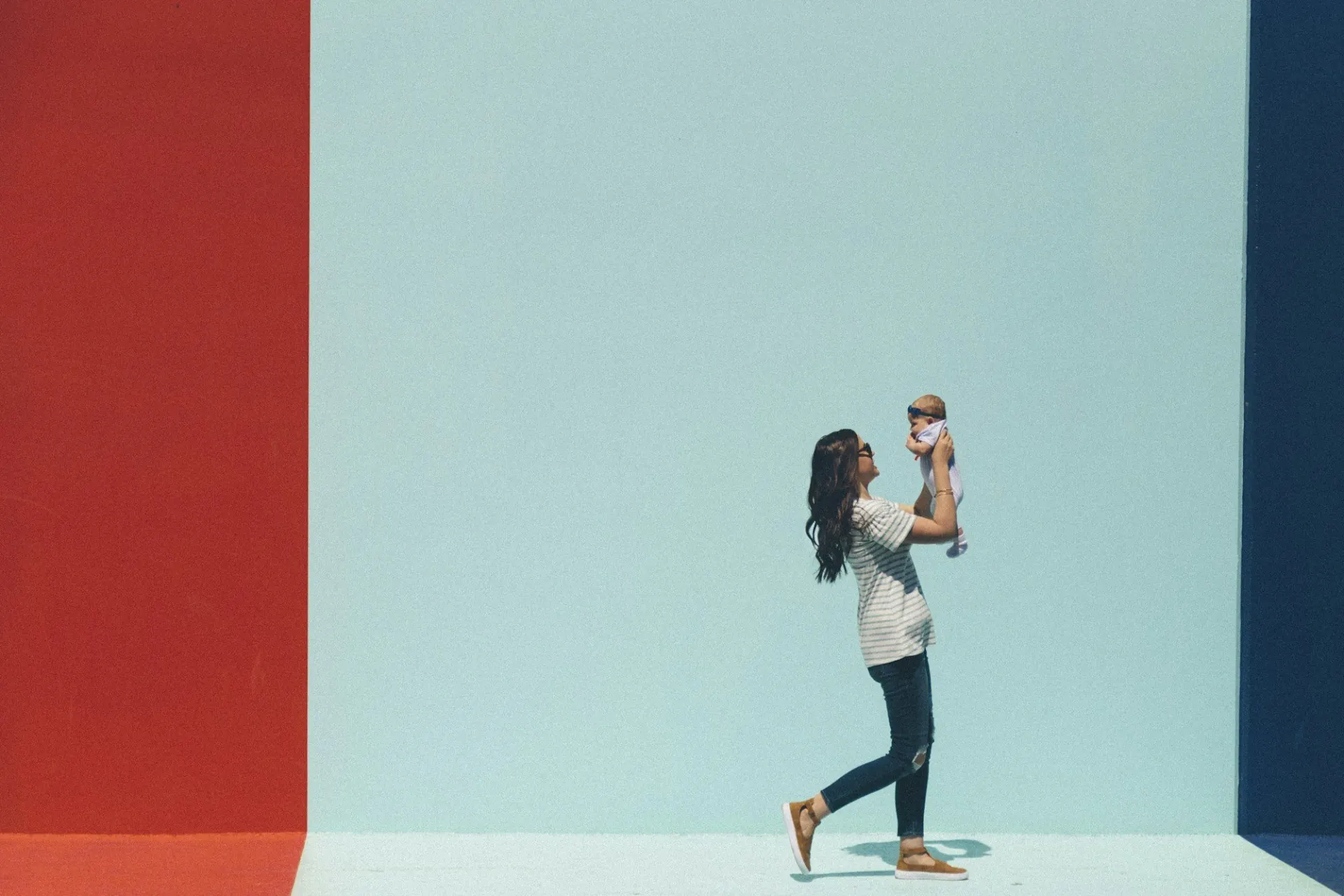 A baby lifted up in the air